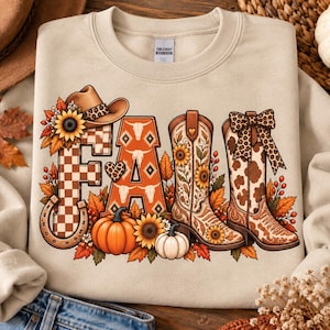 May include: A beige crewneck sweatshirt featuring a graphic print that spells FALL. The letters are decorated with a cowboy hat, sunflowers, a horseshoe, a pumpkin, a white pumpkin, and two western-style cowboy boots with floral and cow print.