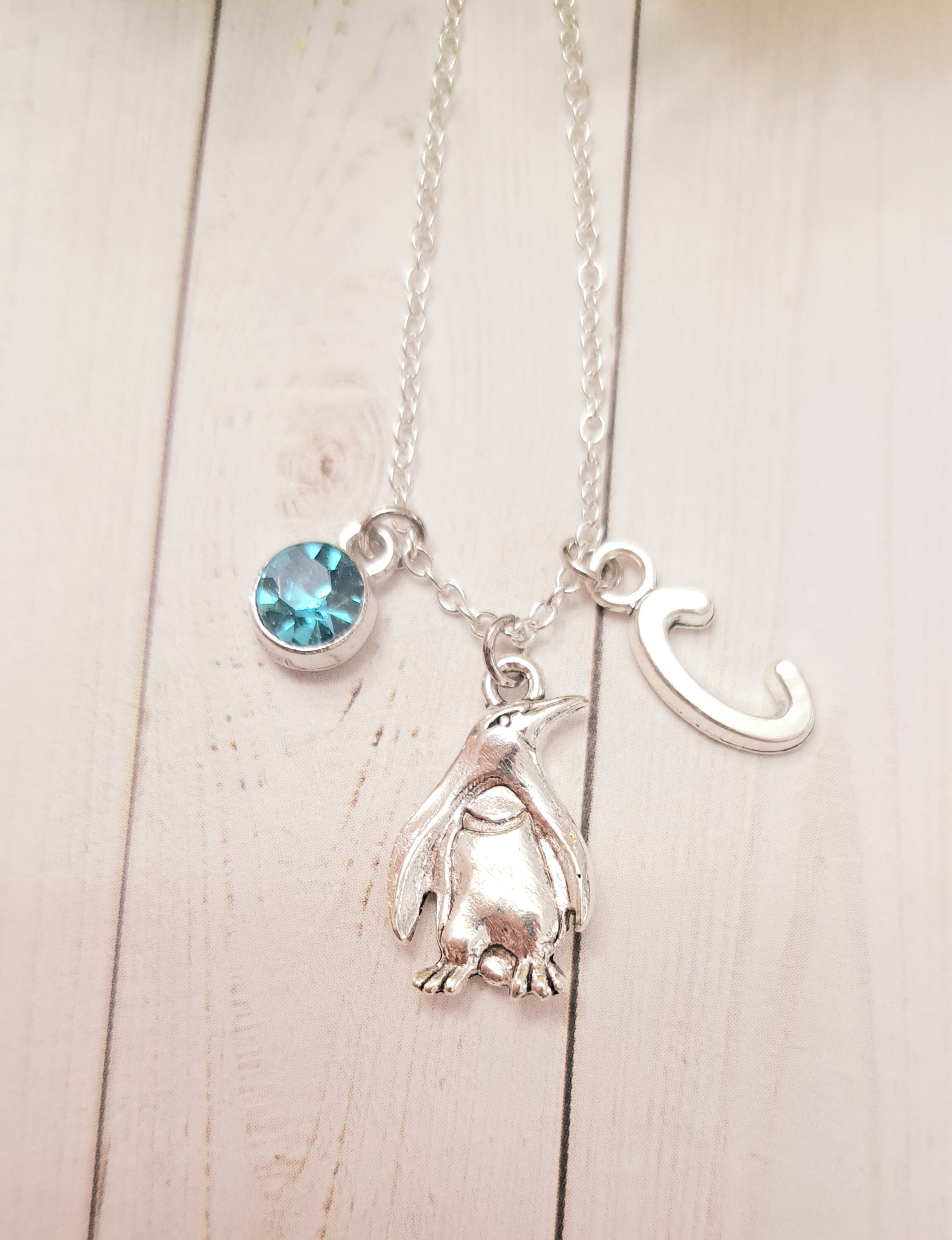 Collana con ciondolo a forma di pinguino articolato in argento