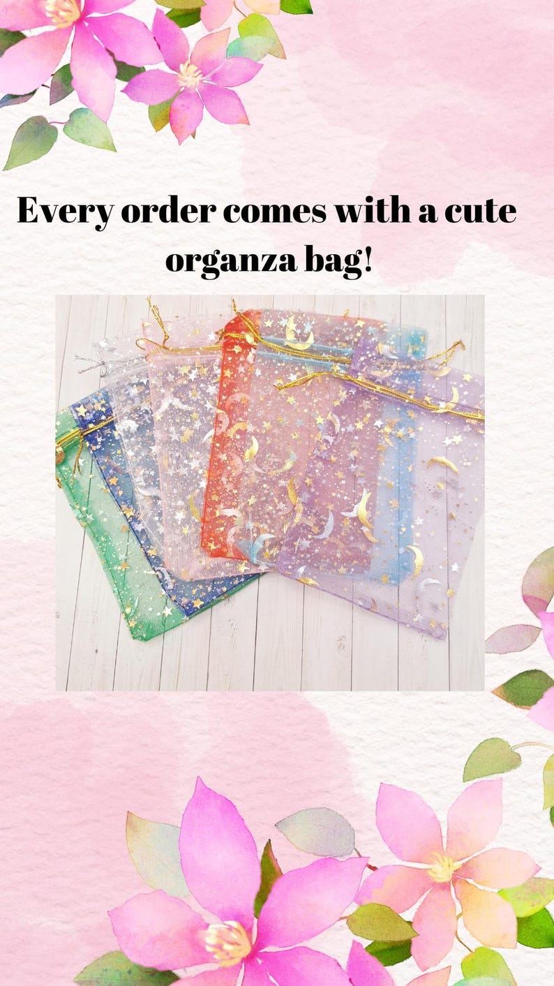 May include: A collection of colorful organza bags with gold drawstrings, decorated with gold stars and crescent moons. The bags are in shades of green, blue, purple, red, and white. Text reads: Every order comes with a cute organza bag!