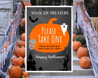 May include: A black and orange Halloween sign with a pumpkin, ghost, and bat. The sign reads "Trick or Treaters Please Take One. Please be kind and leave some for others. Happy Halloween."