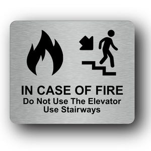 In Case Of Fire Do Not Use Elevator Use Stairways Sign Adhesive Sticker Notice with Universal Icon Symbol and Text (Size 12cm x 10cm)