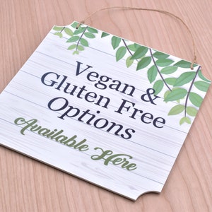Opciones veganas y sin gluten disponibles aquí - Letrero de la ventana de la cafetería / restaurante, aviso de alergia alimentaria