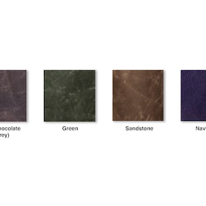 May include: Four fabric swatches in different colors: dark chocolate (grey), green, sandstone, and navy blue.