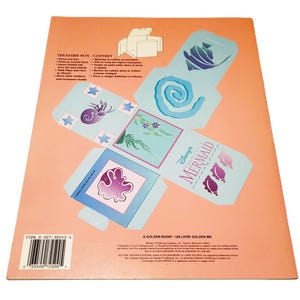 May include: A folded paper treasure box with a mermaid theme. The box is light blue with illustrations of seashells, starfish, and swirls. The text "Disney's The Little Mermaid" is visible.