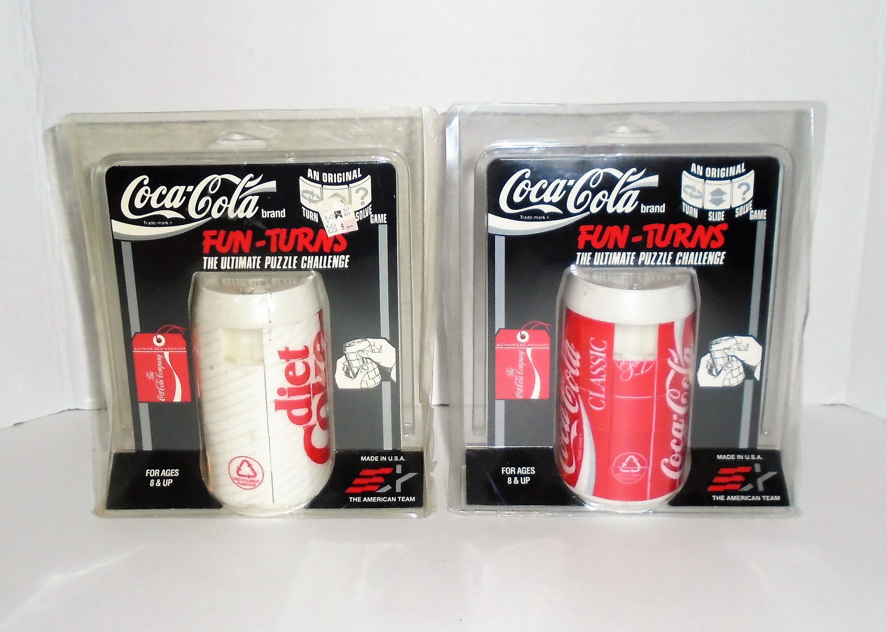 Coca-Cola puzzle in metal container - Northern Kentucky Auction, LLC