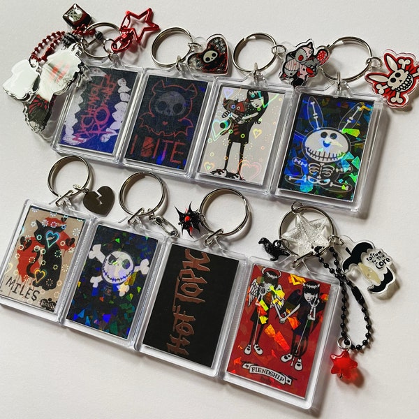 Early 2000s y2k holographic keychains emo charms Emily the strange skelanimals jack skull happy bunny hot topic band album cover goth
