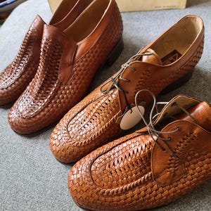 May include: Three pairs of brown leather shoes with a woven pattern. The shoes have a pointed toe and a low heel.