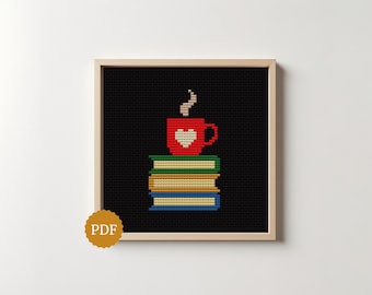 May include: A cross-stitch pattern in a light wood frame featuring a stack of three books in green, tan, and blue, topped with a red mug containing a white heart and steam. A circular gold badge with the text PDF is in the bottom left corner.