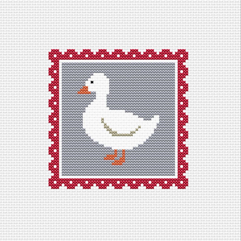 May include: A cross-stitch design featuring a white goose with an orange beak and feet, set against a gray background. The design is framed by a red border with white polka dots, all on a white fabric background.