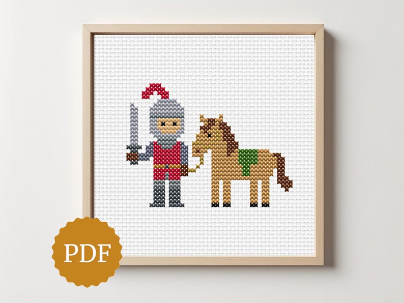 May include: Cross-stitch artwork of a knight holding a sword, standing next to a horse. The knight wears a red tunic, gray armor, and a helmet. The horse is brown with a green saddle. The artwork is framed in a light wood frame.