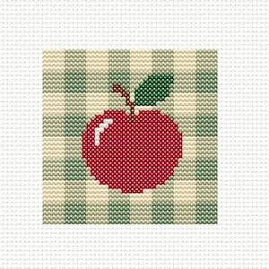 May include: A cross-stitch pattern featuring a bright red apple with a brown stem and a single dark green leaf. The apple is centered against a background of vertical stripes in alternating shades of light beige and muted sage green.