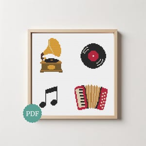 May include: A cross-stitch pattern featuring four musical icons: a yellow gramophone, a black vinyl record with a red center, a black musical note, and a red and beige accordion. The design is displayed within a light wood frame.