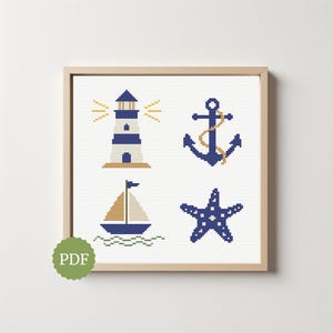 May include: A framed cross-stitch pattern with a nautical theme, including a lighthouse, anchor, sailboat, and starfish. The design uses navy blue, tan, and white, set within a wooden frame. A PDF logo is in the lower left corner.