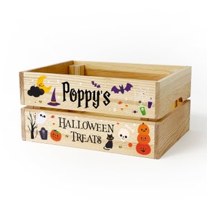 May include: A light-coloured wooden crate featuring the text Poppy's HALLOWEEN TREATS. The design includes colourful illustrations of a crescent moon, witch hat, bats, spider web, ghost, tombstone, jack-o'-lanterns, skull, and a black cat.