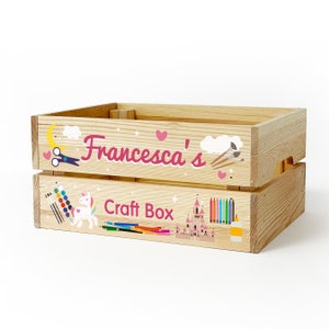 May include: A wooden craft box with a pink and white unicorn, castle, and paintbrush design. The box is labeled "Francesca's Craft Box".