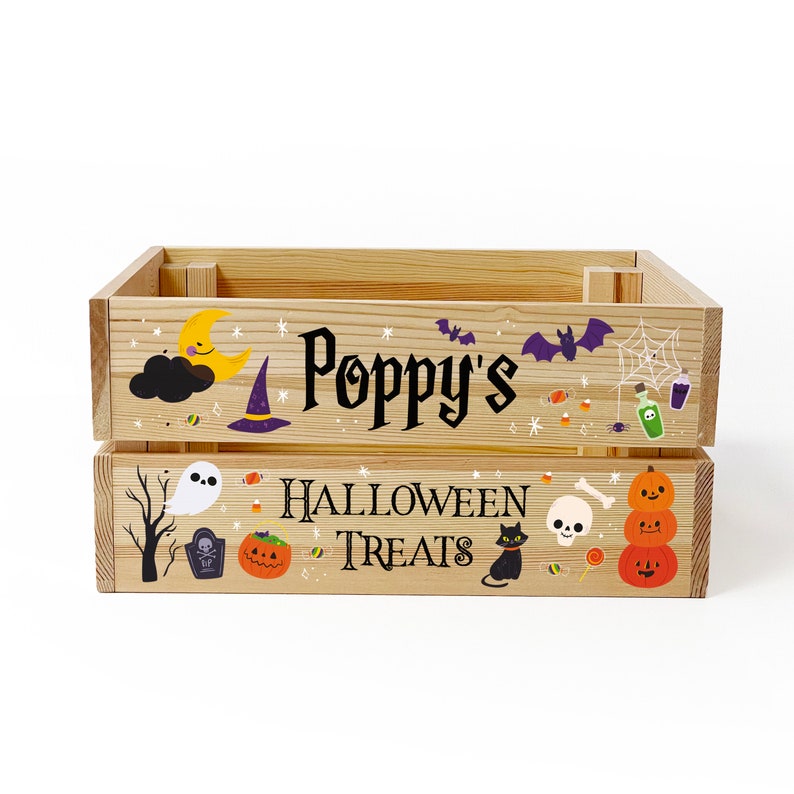 May include: A rectangular wooden crate featuring the text "Poppy's HALLOWEEN TREATS" in black lettering. The crate is decorated with colourful illustrations of a crescent moon, a witch hat, bats, a spider web, a ghost, a tombstone, a black cat, and pumpkins.