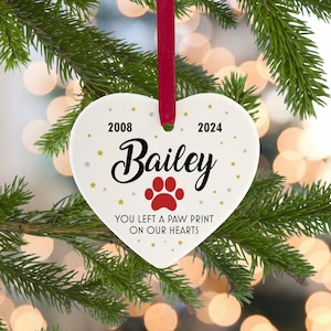 Personalised Dog or Cat Ceramic Remembrance Christmas Tree Decoration, Memorial Bauble For Pets, Dogs, &quot;You Left A Paw Print On Our Hearts&quot;
