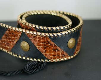 Vintage riem van leer en metaal