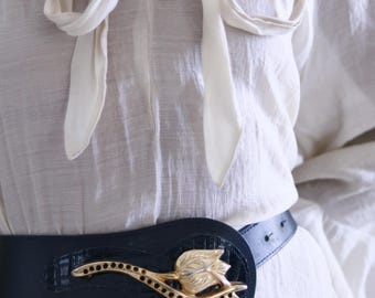Leather belt with gold buckle