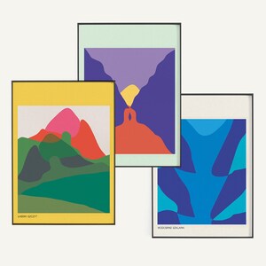 May include: Three framed abstract art prints with colorful geometric shapes. The first print features a yellow background with green, red, and pink mountains. The second print has a light green background with purple, red, and yellow shapes. The third print has a white background with blue and teal shapes. The text on the prints reads "LABSKI SZCZYT" and "WODOSPAD SZKLARKI".