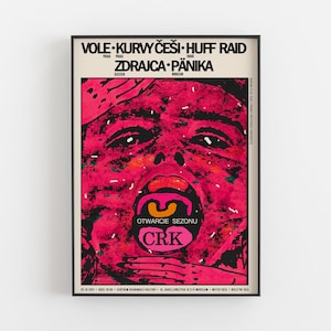 May include: A pink and black concert poster with the text "VOLE KURVYČEŠI HUFF RAID" and "ZDRAJCA PÄNIKA" in bold black letters. The poster also includes the text "OTWARCIE SEZONU" and "CRK" in a pink circle.