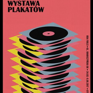 May include: A poster advertising an exhibition of posters titled "Placki Na Papierze" (Polish for "Pancakes on Paper"). The poster features a stack of colourful, overlapping circles, resembling records or pancakes.