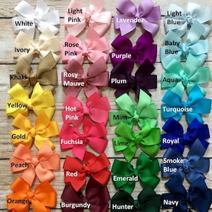 May include: A chart of 20 different colors of ribbon bows, with the color name written below each bow. The colors include white, ivory, khaki, yellow, gold, peach, orange, coral, light pink, rose pink, rosy mauve, hot pink, fuchsia, red, burgundy, brown, lavender, purple, plum, light blue, baby blue, aqua, turquoise, royal blue, smoke blue, navy, emerald, hunter, lime, and silver.