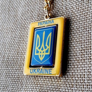 1pc. Ukrainian keychain with the national emblem and a blue-yellow Flag of Ukraine. Ukrainian coat of arms Trident Tryzub Souvenir Gold