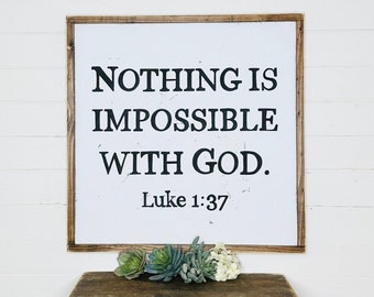May include: White wooden sign with black text that reads "Nothing is impossible with God. Luke 1:37".
