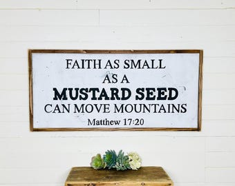 May include: White wooden sign with black text that reads "Faith as small as a mustard seed can move mountains. Matthew 17:20".