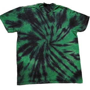 May include: Green and black tie-dye t-shirt. The short-sleeved shirt features a spiral pattern with a dark green and black color scheme. The shirt is made of a soft material and has a crew neck.