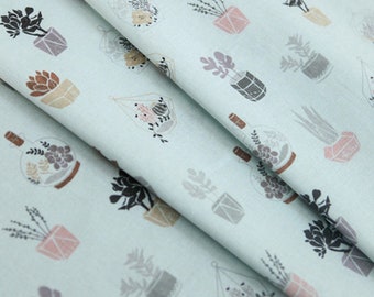 May include: A light blue fabric with a repeating pattern of potted plants. The plants are in various shapes and sizes, and some are in glass containers. The fabric is perfect for crafting projects, such as making pillows, bags, or quilts.