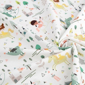 May include: White fabric with a repeating pattern of colourful illustrations of knights, dragons, unicorns, and castles. The fabric is folded and has a white background.