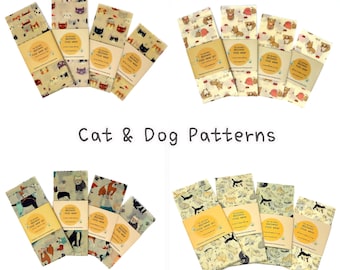 May include: Set of four beeswax food wraps with cat and dog patterns. The wraps are made of natural beeswax, jojoba oil, and tree resin. They are reusable and washable. The wraps are perfect for covering bowls, sandwiches, and snacks.