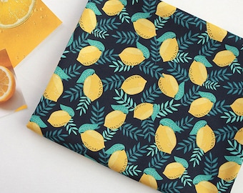 May include: A dark blue fabric with a repeating pattern of yellow lemons and green leaves.
