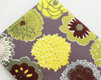 May include: Purple fabric with a floral pattern featuring yellow, green, and brown flowers. The flowers are stylized and have a retro look.