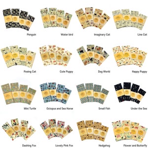 May include: Set of 16 colorful beeswax food wraps with various animal and nature-themed designs. Each wrap features a different pattern, including penguins, water birds, cats, dogs, turtles, seahorses, fish, foxes, hedgehogs, and butterflies.