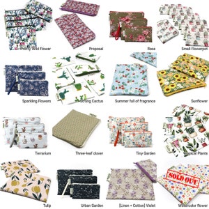 May include: A collection of 12 different reusable zippered pouches with various floral and nature-themed designs. The pouches are made of fabric and have a zipper closure. The designs include flowers, cacti, sunflowers, and more.