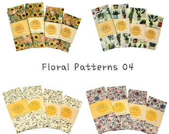 May include: Set of four beeswax food wraps with floral patterns. The wraps are in two different designs: one with sunflowers and one with a leafy pattern. The wraps are labeled "The Original Beeswax Food Wrap Set".