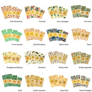 May include: Set of 16 reusable food wraps with various colorful designs and patterns. The wraps feature different fruits, vegetables, and other designs, such as pineapples, strawberries, and avocados. The wraps are made of beeswax, jojoba oil, and tree resin.