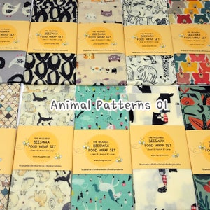 May include: A set of reusable beeswax food wraps featuring a variety of animal patterns. The wraps are available in three sizes: small, medium and large. The text on the wraps reads "The Reusable Beeswax Food Wrap Set".