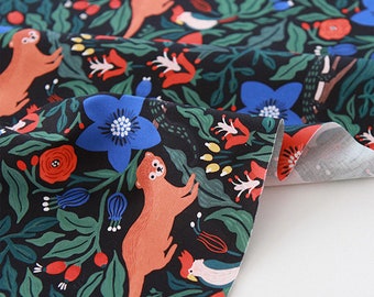 May include: Black fabric with a repeating pattern of red, blue, and orange flowers, green leaves, and orange otters. The fabric has a white backing.