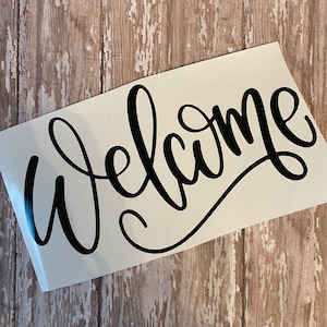 Vinyl sticker decal shown in the default font that is a beautiful script font. Shown in black