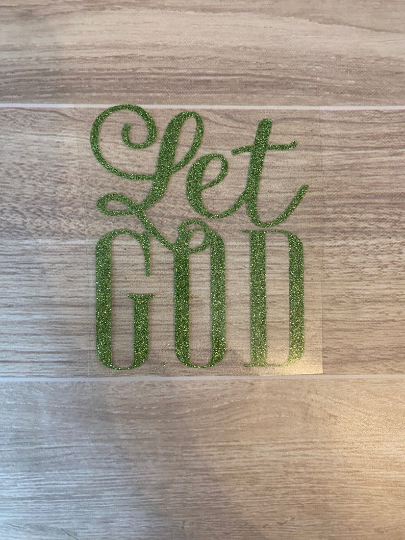 This image shows a Let God iron on transfer in light green glitter