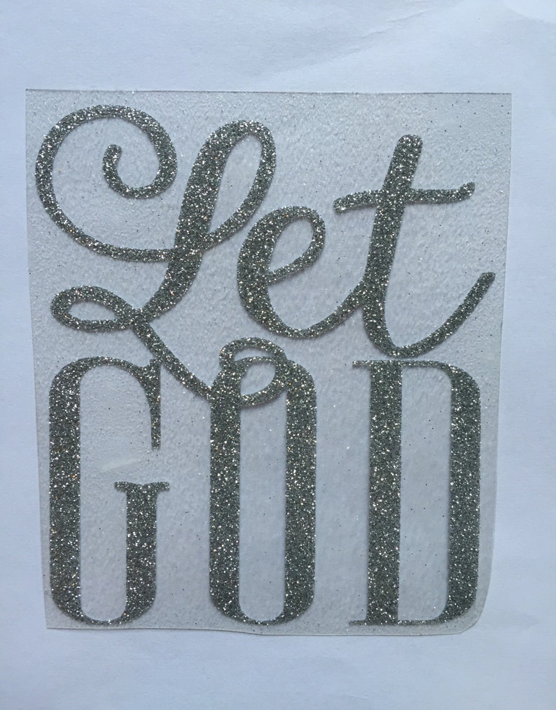Op de afbeelding: Zilveren glitter vinyl sticker met de woorden "Let God" in een cursief schrift.