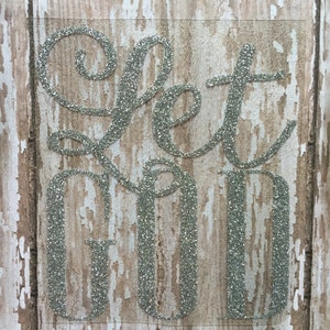 This image shows a Let God heat transfer decal in silver glitter