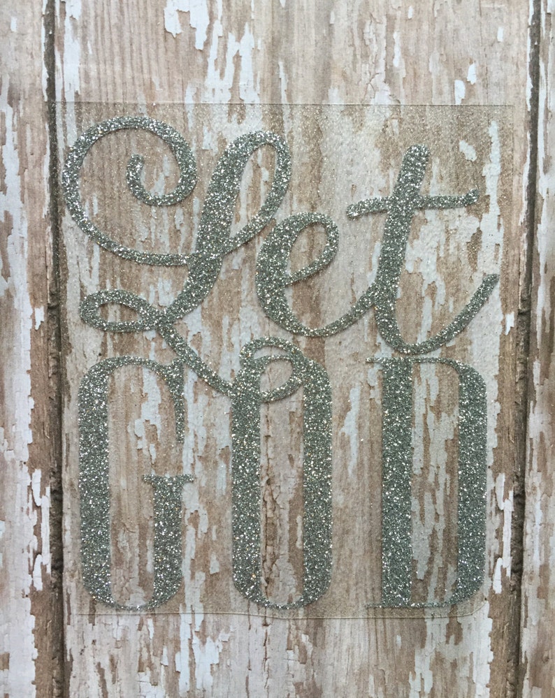 This image shows a Let God heat transfer decal in silver glitter
