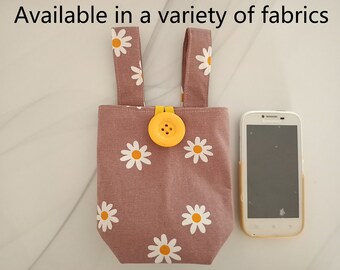 Uchwyt na telefon Daisy do wózka inwalidzkiego: bawełniany organizer na podłokietnik