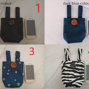 May include: Four different phone pouches with different patterns and colors. The pouches are made of fabric and have a button closure. The pouches are numbered 1 through 4. The pouches are all the same size and shape. The pouches are all made of fabric and have a button closure.