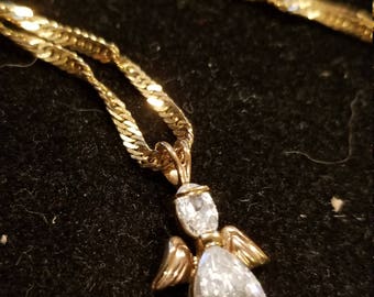 Italy Gold over Sterling silver necklace and cz angel pendant. Both marked 925 Sterling silver 23inch chain